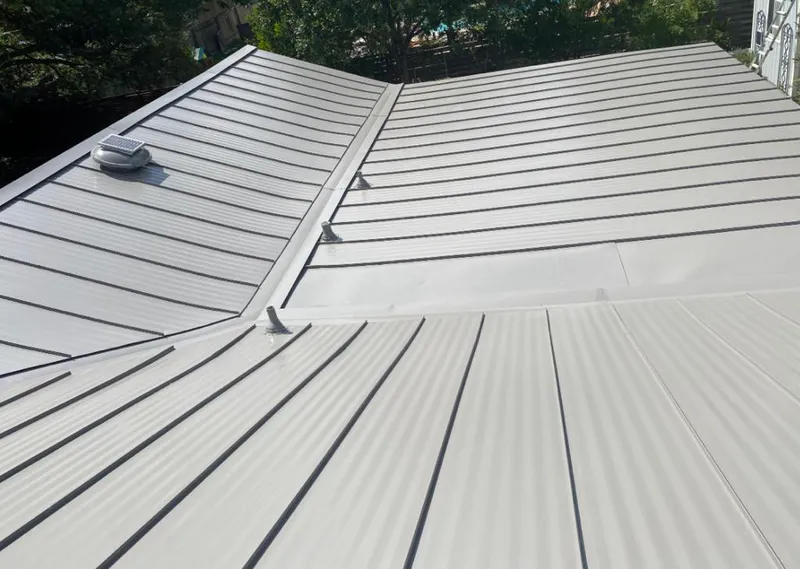 Solar attic fan installed on a metal roof for Roof Ventilation in Senatobia